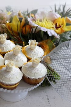 Beautiful cakes and bridal bouquet in orange tones