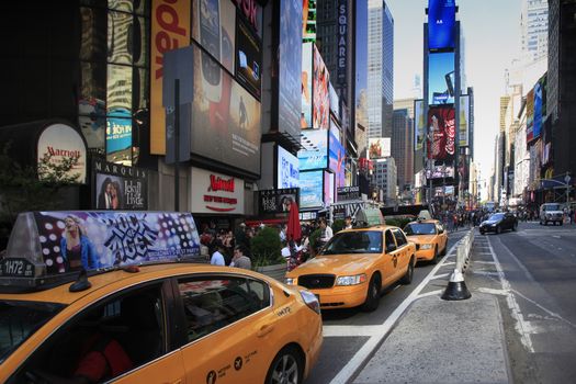 New York, NY, USA - May 17, 2013: Times Square, featured with Broadway Theaters and huge number of LED signs, is a symbol of New York City and the United States, October 12, 2012 in Manhattan, New York City