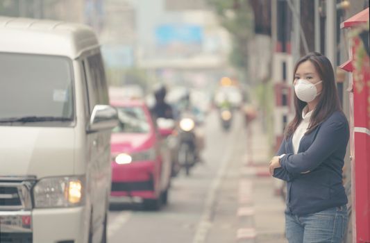 woman wearing protective mask in the city street, Bangkok thailand