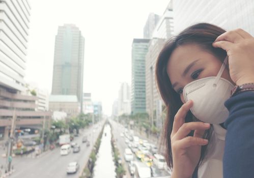 woman wearing protective mask in the city street, Bangkok thailand