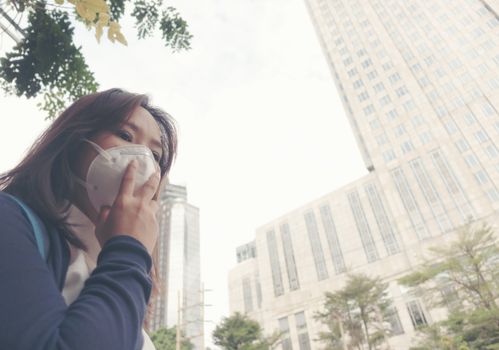 woman wearing protective mask in the city street, Bangkok thailand