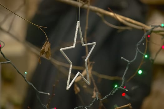 Silver star attached to the Christmas tree as a decoration for this festival recognized all over the world.