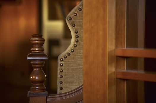 Detail of the profile of a portion of a vintage armchair.