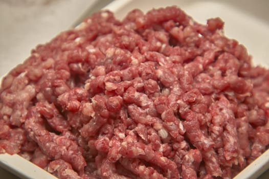 Bowl of minced beef in macro shot, ready to be used in the kitchen for some creative recipe.