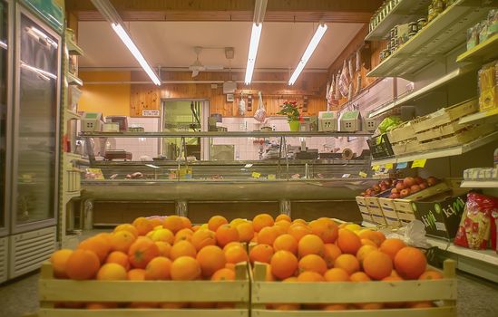 View of the inside of a small supermarket with the butchery counter opposite the point of recovery.