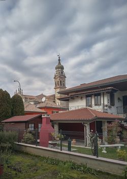 The subsistance of the lines of the buildings of the historic village of Crespino in Veneto (Italy) with the bell tower of the church in the center.