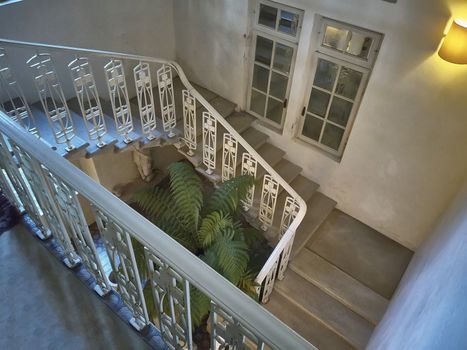 Detail of a spiral staircase inside a period house.