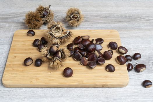 some chestnuts on the wooden table