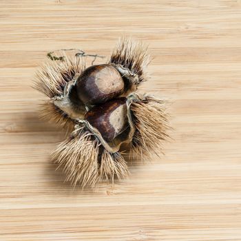 some chestnuts on the wooden table