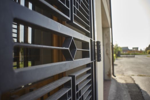 Armored door in artisan iron used for security reasons to protect a home.