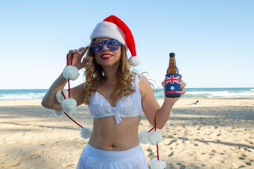A woman enjoys Christmas festivities on the beach in Australia