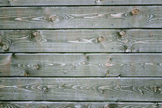 Natural background of wood with annual rings and knots.