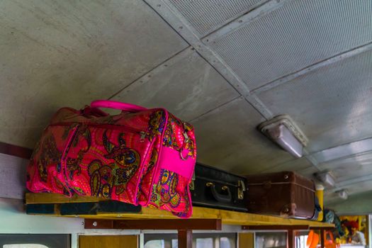 Passengers baggage on a wooden shelf in a old train wagon, Nostalgic transportation and travel background