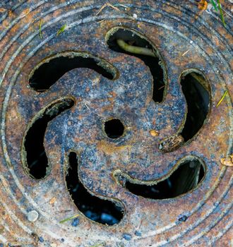 closeup of the lid of a small pit, Drain access point, classical architecture background