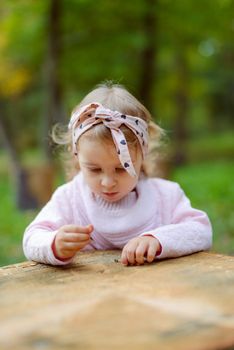beautiful little girl smiling on a sunny day. Blue eyes. head shot.