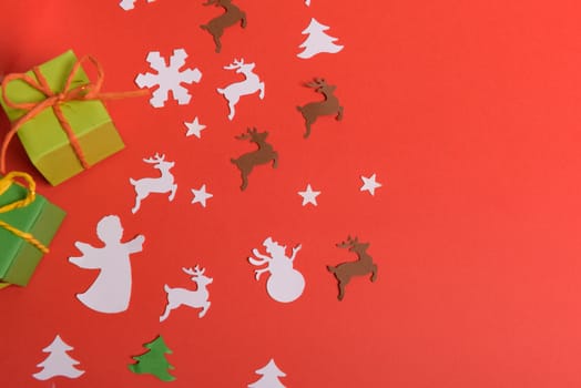 Christmas or New Year background, plain composition made of Xmas decorations and fir branches, flat lay, blank space for a greeting text.