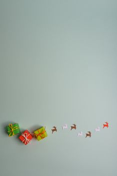 christmas presents nicely decorated with bows and feathers. view from above. Reindeers.
