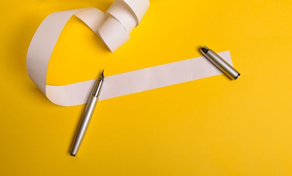 Long twisted expanded letter for Santa Claus. Copy space. yellow background