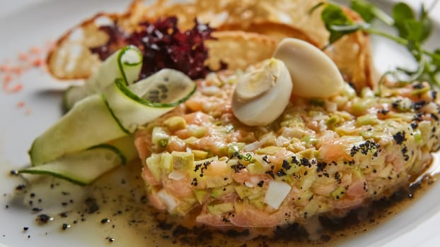 The salmon tartare with avocado. Shallow dof.