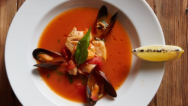 Close up of a bowl of italian seafood soup.