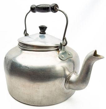 isolated vintage metal kettle against a white background