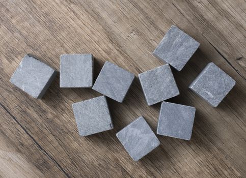 Set of nine spirit chilling gray stones. Soapstone rocks are carved in cubes to be used as drink chiller (whisky, bourbon ...).