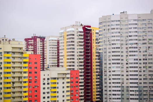 multi-storey houses with bright rskraskoy on a cloudy day