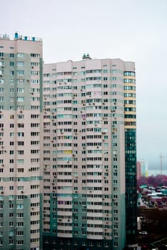 multi-storey houses with bright rskraskoy on a cloudy day