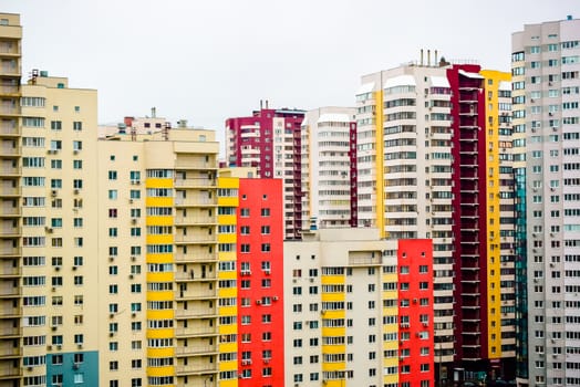 multi-storey houses with bright rskraskoy on a cloudy day