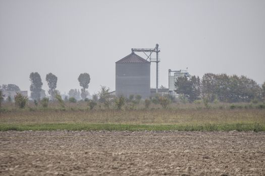 Grain dryer located in the middle of an agricultural area