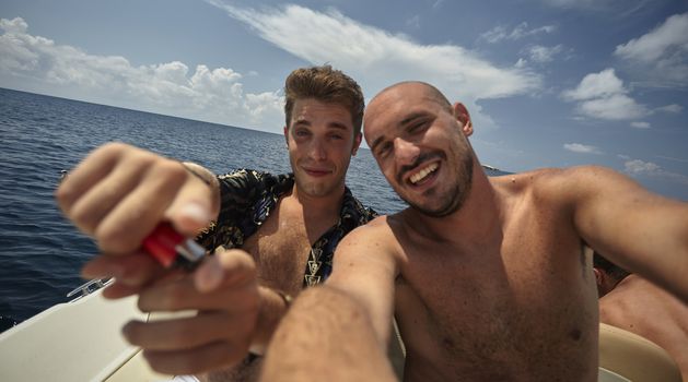 Guys on summer vacation in Sardinia