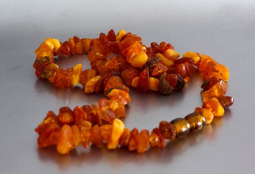 Amber beads. Jewelry made of amber stone. Amber is the petrified resin of coniferous trees in the forest.