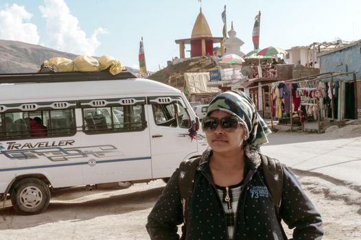 Manali India, October 2019 - Portrait of an Indian Women solo traveler spotted on a mountain hill station while travelling solo on a winter holiday.