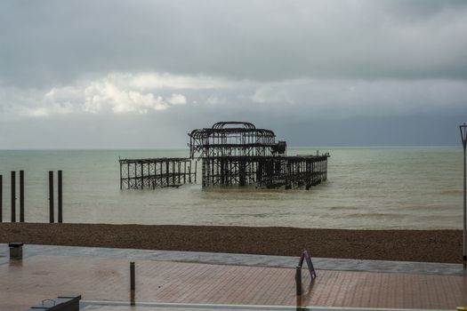 Remains of Brighton West Pier in sea , England, UK.