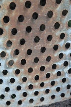 on the background of the old grater. Rusty metal