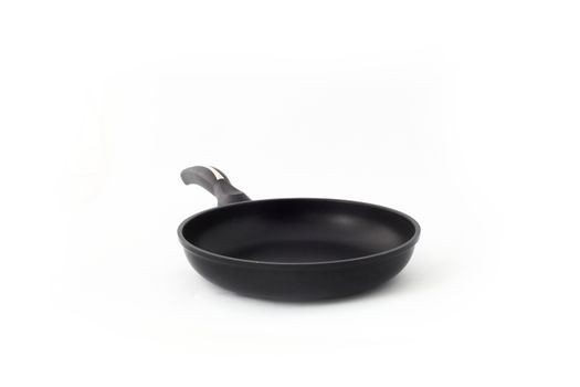 black fry pan over white background