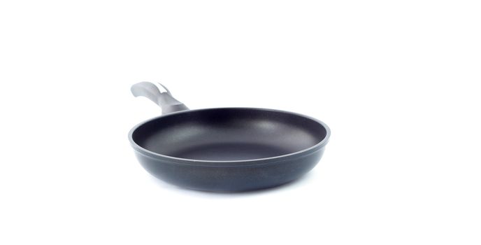 black fry pan over white background