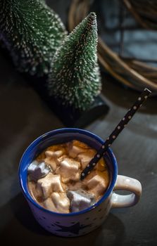 Cup with milk and Marshmallow for christmas. Christmas trees