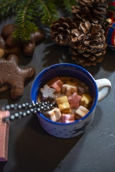 Marshmallow and milk on christmas. Cones and decoration