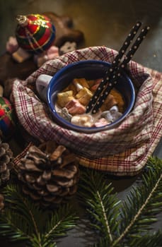 Cup of milk and Marshmallow. Christmas lights and ornaments