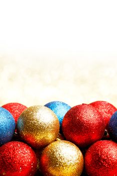 Heap of Christmas balls on golden background