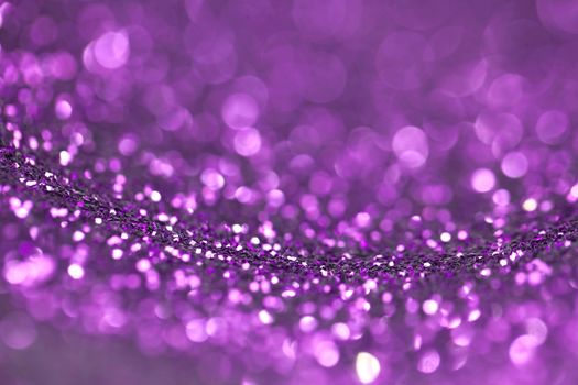 Abstract purple glitter light bokeh holiday party background