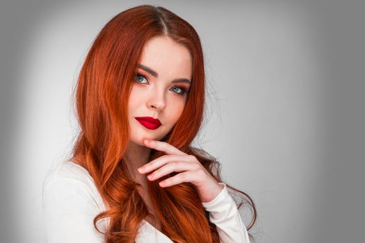 Photoshot of gorgeous redhead girl with bright makeup