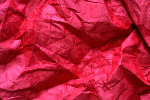 Nice background made from wet red paper closeup