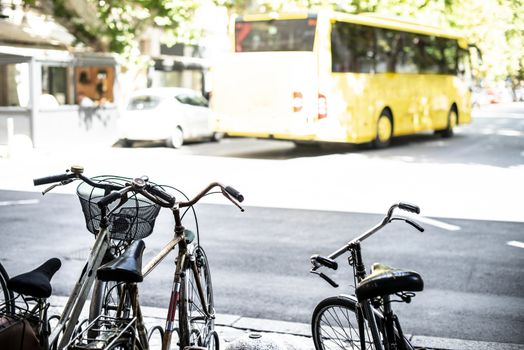 Vintage bikes in city of Ravenna, Italy. Bus on the background.