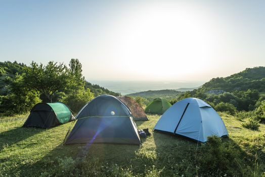 Many tents in the mountain.. Outdoor concept. Sunshine morning in the forest.