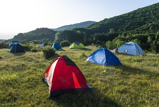 Many tents in the mountain.. Outdoor concept. Sunshine morning in the forest.