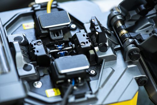 Device for mounting optical cable. Optical internet Technology concept. Optical fiber assembly.