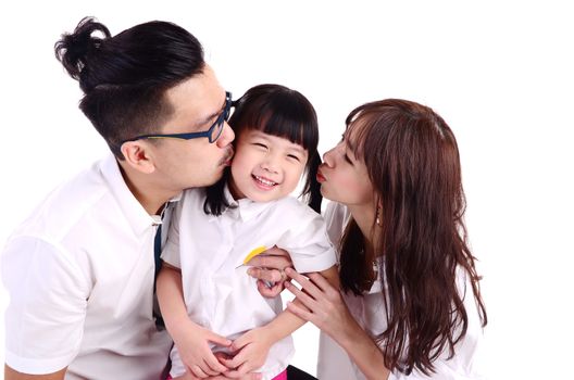 asian parent kissing their cute little girl