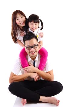 Portrait of a happy asian family in the studio